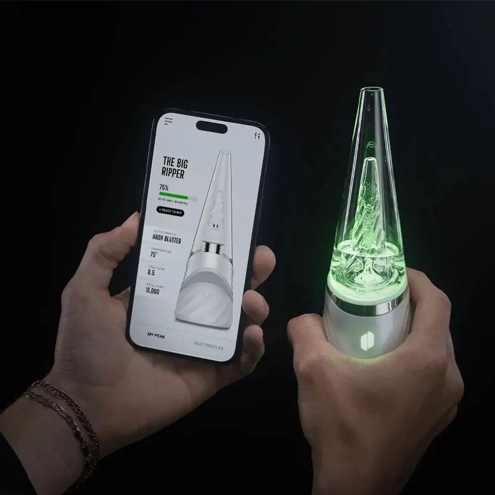 Puffco Peak Pro 3DXL Smart eRig in hand for scale