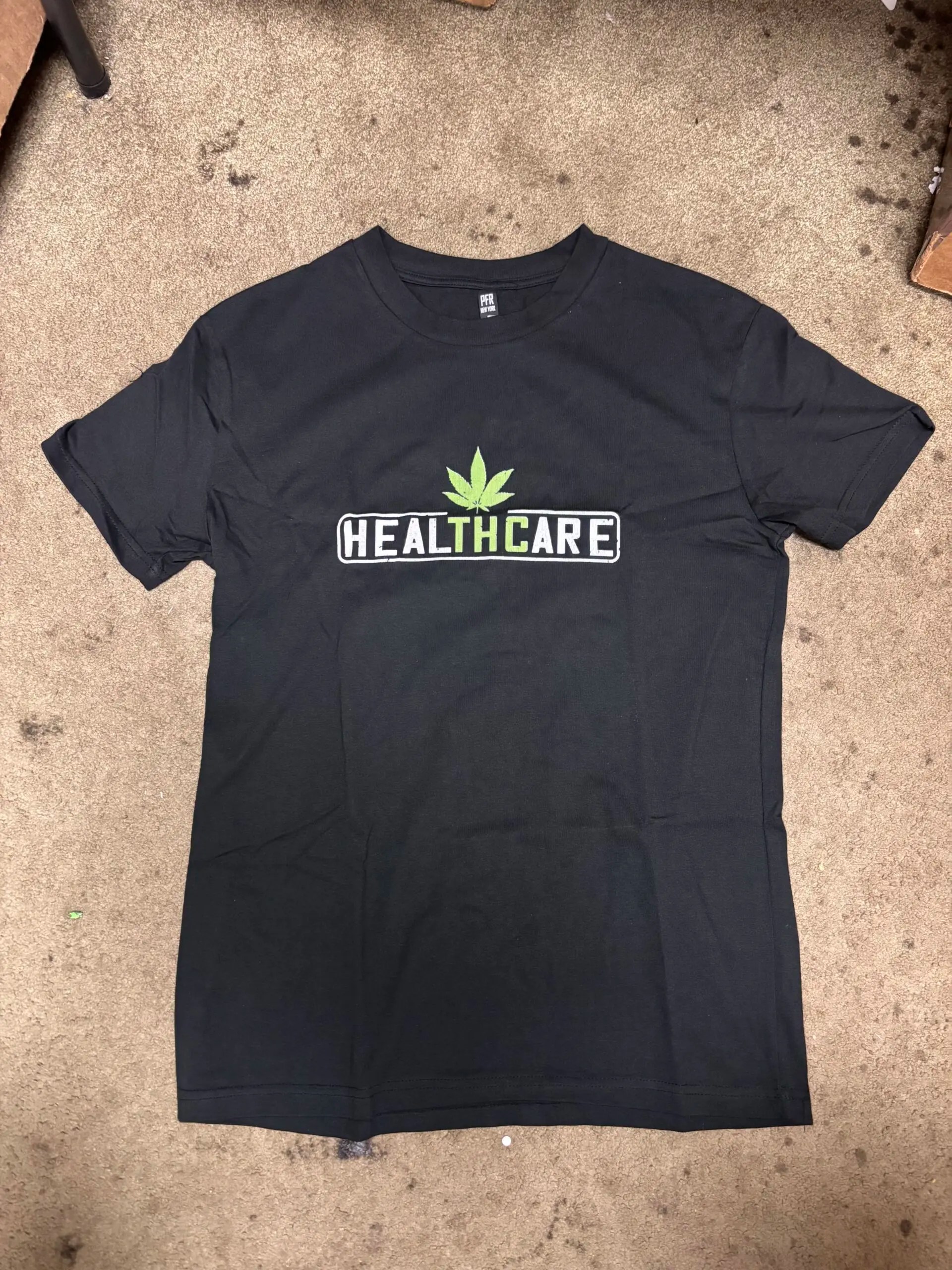 Remedy Center Graphic Tees healTHCare design on black cotton t-shirt
